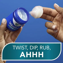 Vicks VapoRub Advanced Plus chest rub jar and spoonful of ointment