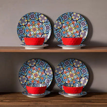 Ceramic dinnerware plates with blue floral design and red bowls
