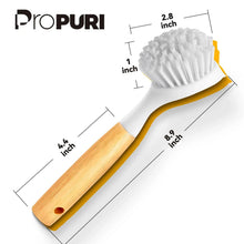 Dish scrub brush with bamboo handle and white bristle head, side profile