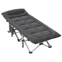 Portable camping cot with quilted padded mattress and headrest, dark gray fabric