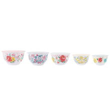 Assorted floral melamine mixing bowls set with white exteriors and different colored interiors