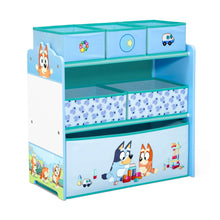 Blue children's toy storage organizer with cubbies, fabric bin drawers, and character artwork