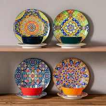 Boho ceramic dinnerware set with colorful patterned bowls and plates on a shelf
