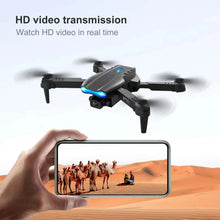 Quadcopter drone with front camera displaying HD video on a smartphone screen