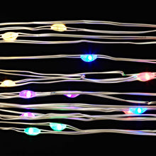 Multicolor LED wire lights with clear bulbs on silver wire, close-up