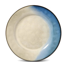 Reactive ceramic dinner plate, cream center with blue speckled rim and glossy glaze