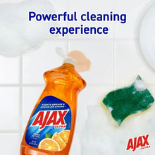 Ajax Ultra orange triple action dishwashing liquid bottle with sponge cleaning a surface