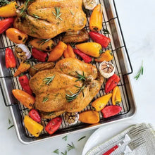 Extra-large oven crisping baking tray with wire rack, holding roasted chicken and veg.