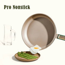 Green nonstick frying skillet with long handle and empty interior surface