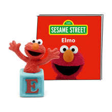 Elmo audio figurine with blue base showing letter E, beside Sesame Street Elmo card.
