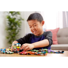 1:64 toy car set of 8 cars and trucks on table with child playing