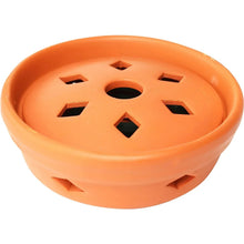 Orange round mosquito coil burner base with vented top and central hole