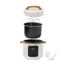 Speckled white electric pressure cooker with open lid and inner pot shown