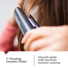 Remington flat iron gliding through hair, showing purple ceramic plates