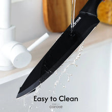 Black ceramic-coated chef knife with water droplets for easy-cleaning performance