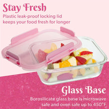 Glass food storage container with pink locking lid, holds fruit and cheese