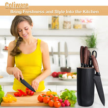 Kitchen knife set with dark-handled stainless knives in a ribbed black holder