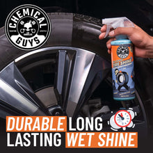 Tire shine spray bottle with applicator on a wheel and rim
