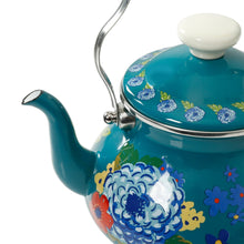 Teal enamel tea kettle with blue and yellow floral pattern, white knob lid.