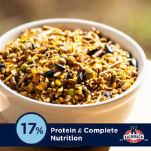 Bowl of chicken layer feed with mixed grains, seeds, and pellets