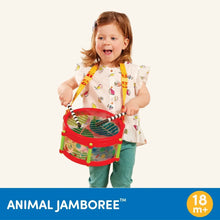 Child holding a red animal toy drum with colorful strap and handle