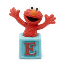 Elmo musical audio figurine with open-mouthed face, arms out, blue base with letter E.