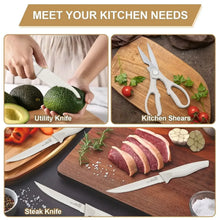 White utility knife, kitchen shears, and steak knife with sliced meat on a board