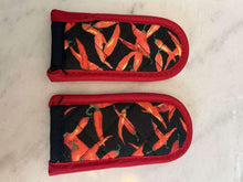 Skillet handle cover set of two sleeves, black chili pepper print with red trim