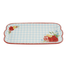 Ceramic serving platter with light blue gingham, red scalloped border, and floral corner details