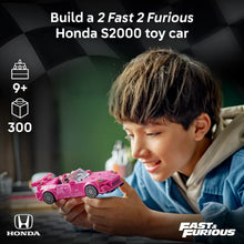 Pink LEGO Speed Champions race car toy held by a child