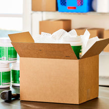 Large open shipping box in brown with packing paper and containers