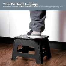 Foldable plastic step stool, black with textured top and anti-skid feet for stable stepping