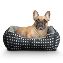 Plush pet bed with black-and-white diamond weave and gray plush bolster for pets