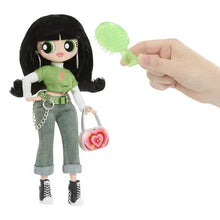 Doll with black hair, green top and gray jeans, plus belt chain and heart purse.