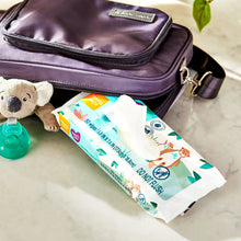Fragrance-free baby wipes travel pack in a zip pouch with baby items nearby