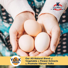 Hands holding four white eggs with Yolk Proud label