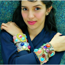 E6000 Jewelry & Bead adhesive shown with colorful rhinestone bead bracelets on model