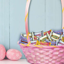 Easter basket filled with wrapped mini chocolate bars, including Twix and Snickers