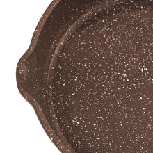 Brown speckled cast aluminum fry pan interior surface