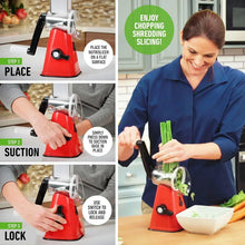 Red rotary cheese grater on countertop with clear hopper and crank handle