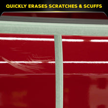 Red car paint close-up showing light scratch and swirl marks