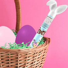 Easter candy basket with bunny-shaped M&M's candy cane and pastel egg candies