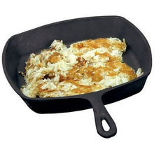 Square cast iron skillet with short handle, baked casserole with browned top.