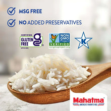 Basmati rice grains in a wooden spoon, white long-grain rice