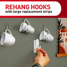 Command rehanging hooks with large replacement strips, shown holding a mug