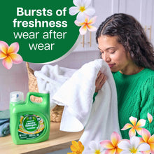 Member's Mark laundry detergent jug beside a person holding a white towel