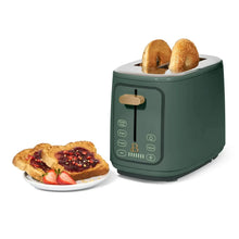 Dark green 2-slice toaster with two toasted bread slices in slots