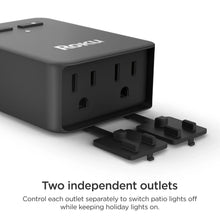 Outdoor smart plug close-up showing two separate outlet ports with plug adaptors
