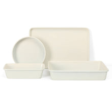 White metal bakeware set with round dish, large rectangular tray, and rectangular baking pan