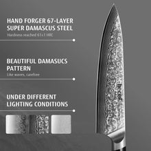 Damascus steel chef knife blade detail with black handle edge